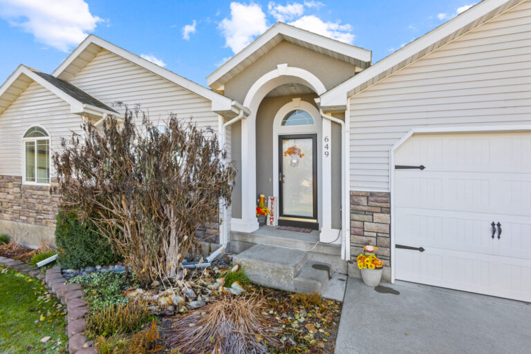 A home exterior look with small trees nearby